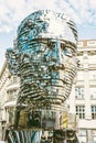 Moving statue of Franz Kafka in Prague, yellow filter Royalty Free Stock Photo